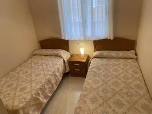Postel nebo postele na pokoji v ubytování Apartamentos Marina Park