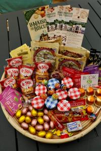 a plate filled with different types of food on a table at Cosy apartment with large terrace near the beach in Barneville-Carteret