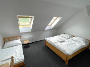 Postel nebo postele na pokoji v ubytování Hotel Joker