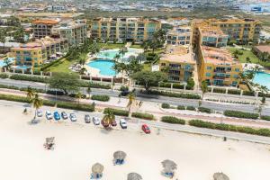an aerial view of a resort with a beach at Beachfront - Supreme View 2BR condo - A344 in Palm-Eagle Beach