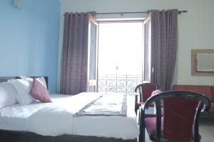 Postel nebo postele na pokoji v ubytování Hotel Stay 49 - Near Apollo Hospital