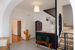 a living room with a staircase in a house at Tenuta Maison Angelina in Formia