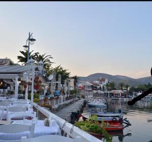 a group of tables and boats in a marina at Kapnos - Classy and spacious place with a sea view in Kavála