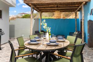 a table and chairs in the patio of a house at Casa Tortuga in Grote Berg