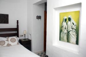 Posteľ alebo postele v izbe v ubytovaní Hostal Extramuros