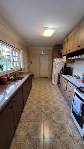 a kitchen with a sink and a counter top at Casa Clorophila in Vila Velha +6 photos