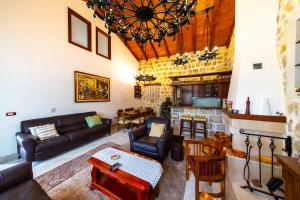 a living room with a couch and a table at Blake's Villa in Budva