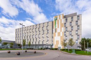 a large building in front of a building at Holiday Inn Express Aberdeen Airport by IHG in Dyce
