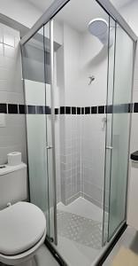 a bathroom with a glass shower with a toilet at BESSA VISTA MAR, 100m da orla, 1 dorm. e garagem in Nossa Senhora do Livramento +24 photos