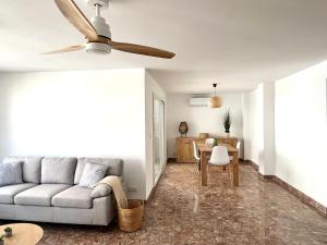 a living room with a couch and a table at El sitio de Ana in Burriana