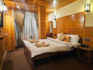 Postel nebo postele na pokoji v ubytování Hotel Golden Orchid