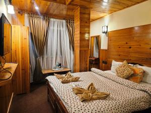 Postel nebo postele na pokoji v ubytování Hotel Golden Orchid