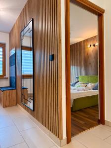 Ένα ή περισσότερα κρεβάτια σε δωμάτιο στο Apartament Leśny z kominkiem - Viva Pod Giewontem Apartamenty +44 φωτογραφίες