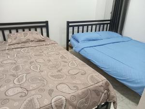 Ένα ή περισσότερα κρεβάτια σε δωμάτιο στο Lomthalay Hotel