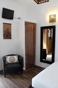 Posteľ alebo postele v izbe v ubytovaní Hostal Extramuros