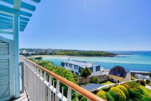 a view of the ocean from the balcony of a building at Le Phare de Trescadec - maeva Home - 2 Pièces 4 Personnes Sélection MAE-3559 in Audierne