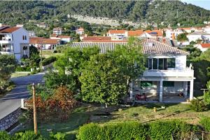 an aerial view of a house in a city at Apartmani Kordić in Barbat na Rabu
