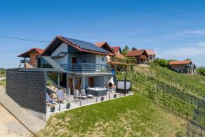 a house on the side of a hill at View&Wine Jacuzzi -Tuheljske toplice in Veliko Trgovišće