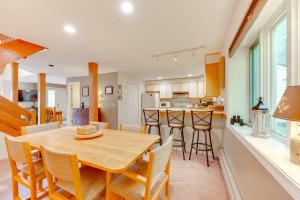 a kitchen and dining room with a wooden table and chairs at Charming Jackson Mountain Retreat on Golf Course! in Jackson