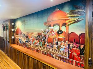 a mural on the wall of a room at Kushi's Nap N Go Dormitory in Visakhapatnam