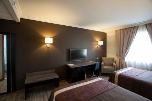 Postel nebo postele na pokoji v ubytování Hotel Diego de Almagro Osorno