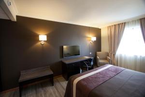 Postel nebo postele na pokoji v ubytování Hotel Diego de Almagro Osorno