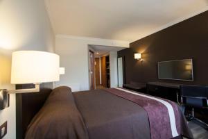 Postel nebo postele na pokoji v ubytování Hotel Diego de Almagro Osorno