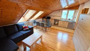 a living room with a couch and a table at Apartamento Playa Catedrales & Piscina I in San Pedro de Benquerencia
