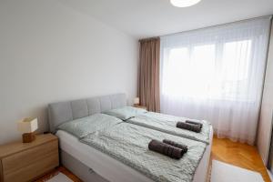 Postel nebo postele na pokoji v ubytování Panorama Residence - Samorin near X-Bionic sphere