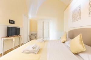 Postel nebo postele na pokoji v ubytování Dimora Le Tre Muse Guesthouse