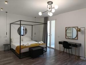 Posteľ alebo postele v izbe v ubytovaní Residence Le Aromatiche