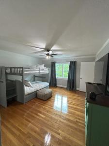 a bedroom with a bed and a ceiling fan at The Nest in Mobile