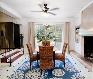 a dining room with a table and chairs at The Nest in Mobile