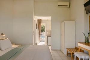 Postel nebo postele na pokoji v ubytování Panorama Fanari studios and apartments