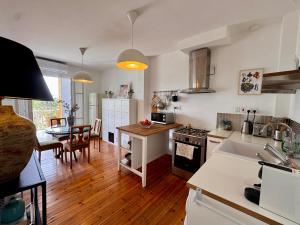 a kitchen and living room with a table and chairs at Liberty House - Central Two Bedroom Apartments in Nicosia