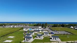 an aerial view of a village with white houses at Easkey Glamping Village in Easkey