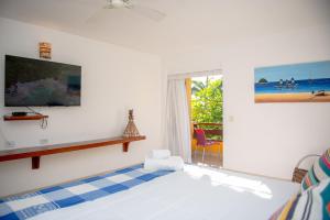 Ένα ή περισσότερα κρεβάτια σε δωμάτιο στο Pousada João Fernandes +40 φωτογραφίες