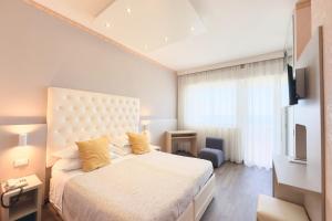 Postel nebo postele na pokoji v ubytování Hotel Benini