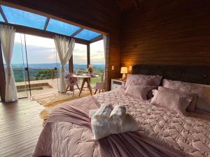 Postel nebo postele na pokoji v ubytování Chalés Santa Carolina