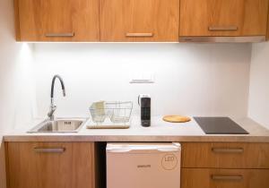 a kitchen with a sink and a counter top at Villa Marina in Posidhonía