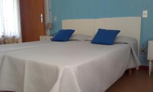 Posteľ alebo postele v izbe v ubytovaní Casa Palmira