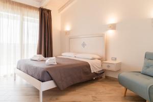 Postel nebo postele na pokoji v ubytování Rena Majore Country Resort