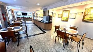 TV a/nebo společenská místnost v ubytování HOTEL DEL REY CURITIBA by POTY - NA FAMOSA RUA XV DE NOVEMBRO