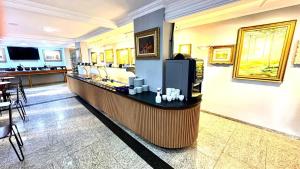 Příslušenství pro přípravu čaje a kávy v ubytování HOTEL DEL REY CURITIBA by POTY - NA FAMOSA RUA XV DE NOVEMBRO