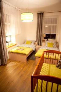 Posteľ alebo postele v izbe v ubytovaní Apartament Bukowe Wzgórze