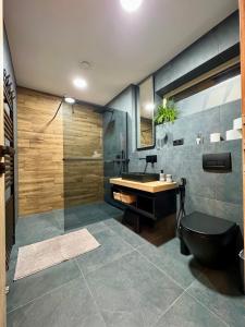 Koupelna v ubytování Apartmány nora