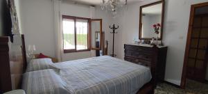 Katil atau katil-katil dalam bilik di Casa vacacional en Vinaròs