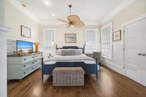 a bedroom with a bed and a dresser at 67 Wiggle Lane - Rosemary Beach - Steps to Tennis Courts, Beach, Pools! in Rosemary Beach +59 photos