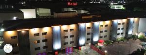 an overhead view of a hotel at night with lights at Hotel y Villas Gran Vía, Tultitlán in Mexico City +61 photos