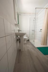 a bathroom with a sink and a toilet and a shower at Apartment MarySol Tamaduste 12m from the Sea & BBQ in Tamaduste